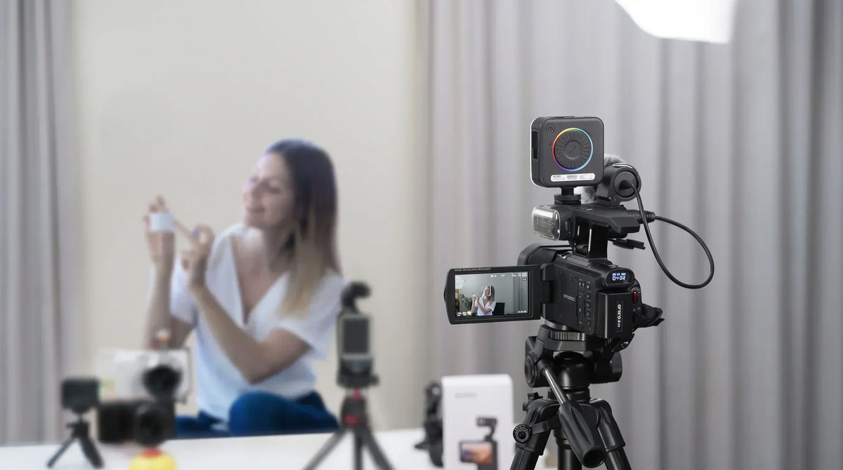 Best budget camcorder for content creators: an ORDRO XV80 5K camera set up on a tripod, recording a product tutorial as a cost-effective alternative to Canon and Sony.