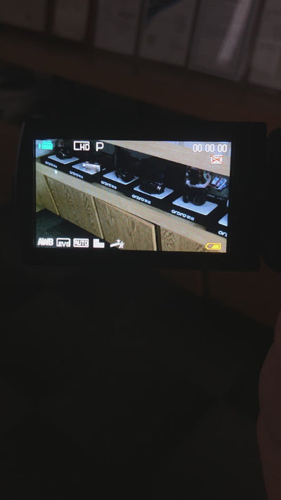 Ordro V12 camera showing infrared (IR) night vision effect, recording clear black and white footage of objects in pitch darkness.